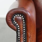 Sheepskin Wingback Chair with Warm Tones and Black Piping