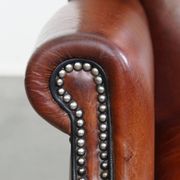 Sheepskin Wingback Chair with Warm Tones and Black Piping