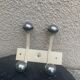 Industrial wall coat rack two hooks in white lacquered metal and vintage silver 1970