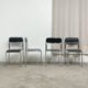 4 chrome metal chairs with black faux leather, 1990