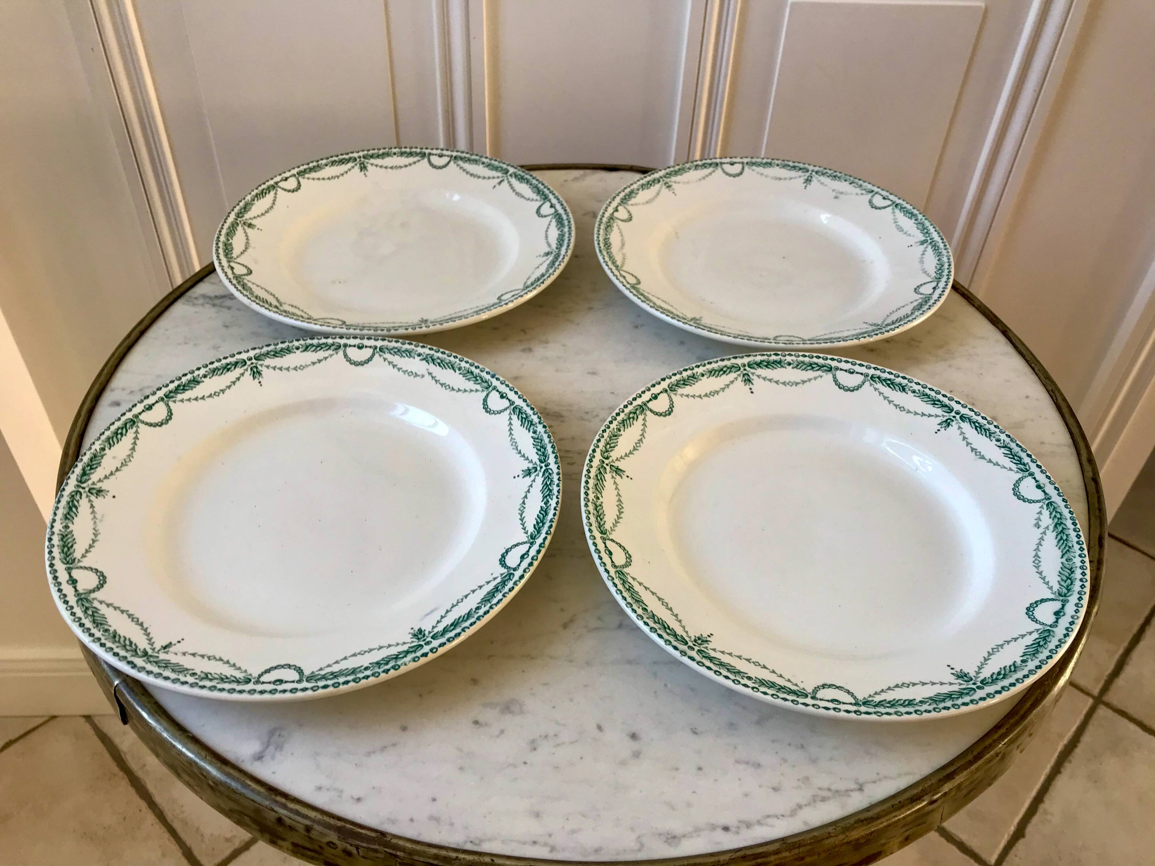 set of 4 flat plates in Terre de Fer Saint Amand model René 19th century