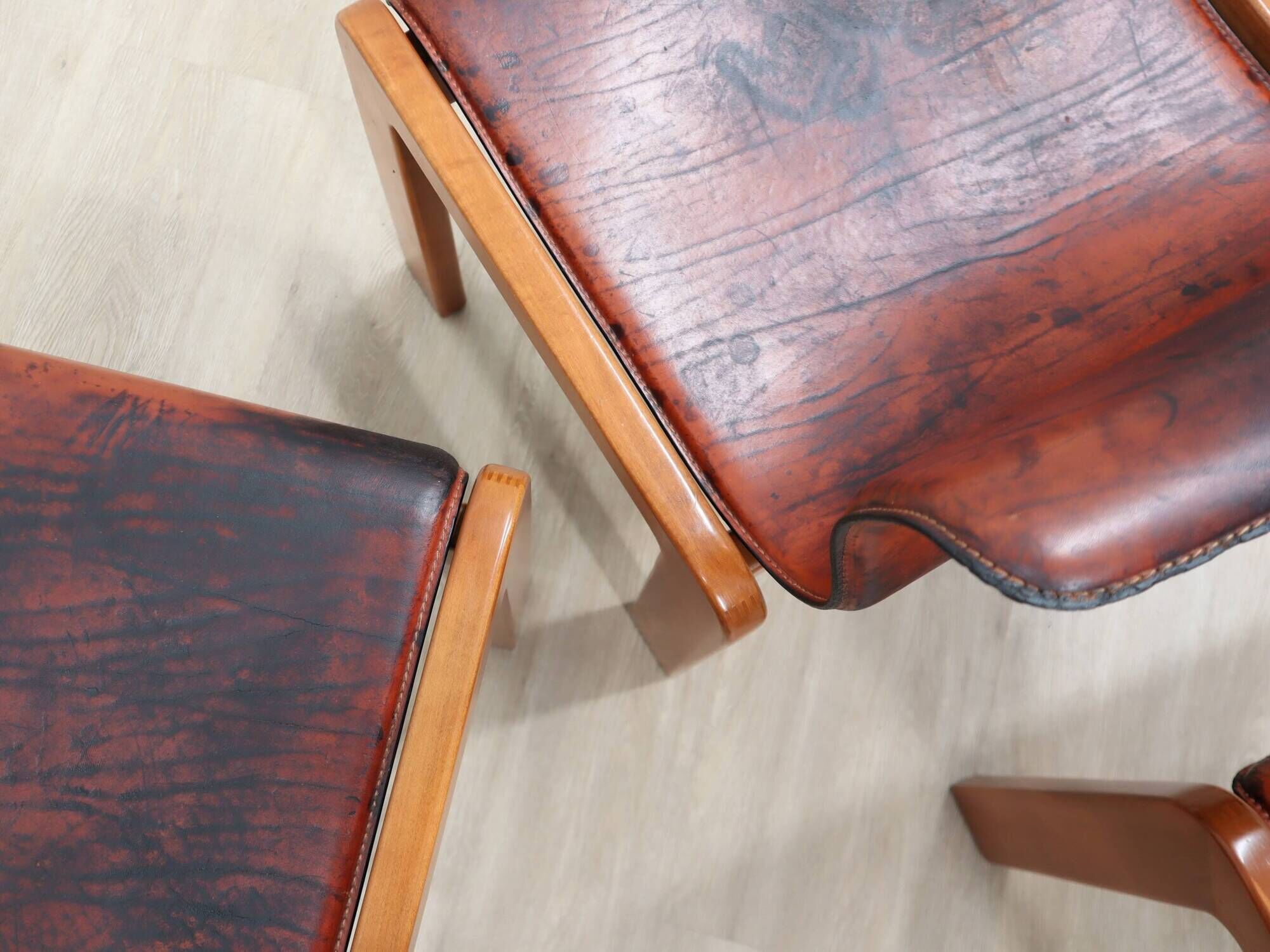 Curved wooden and leather chairs by Afra and Tobia Scarpa from the 1970s, set of 4.