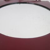 Mirror covered in burgundy leather