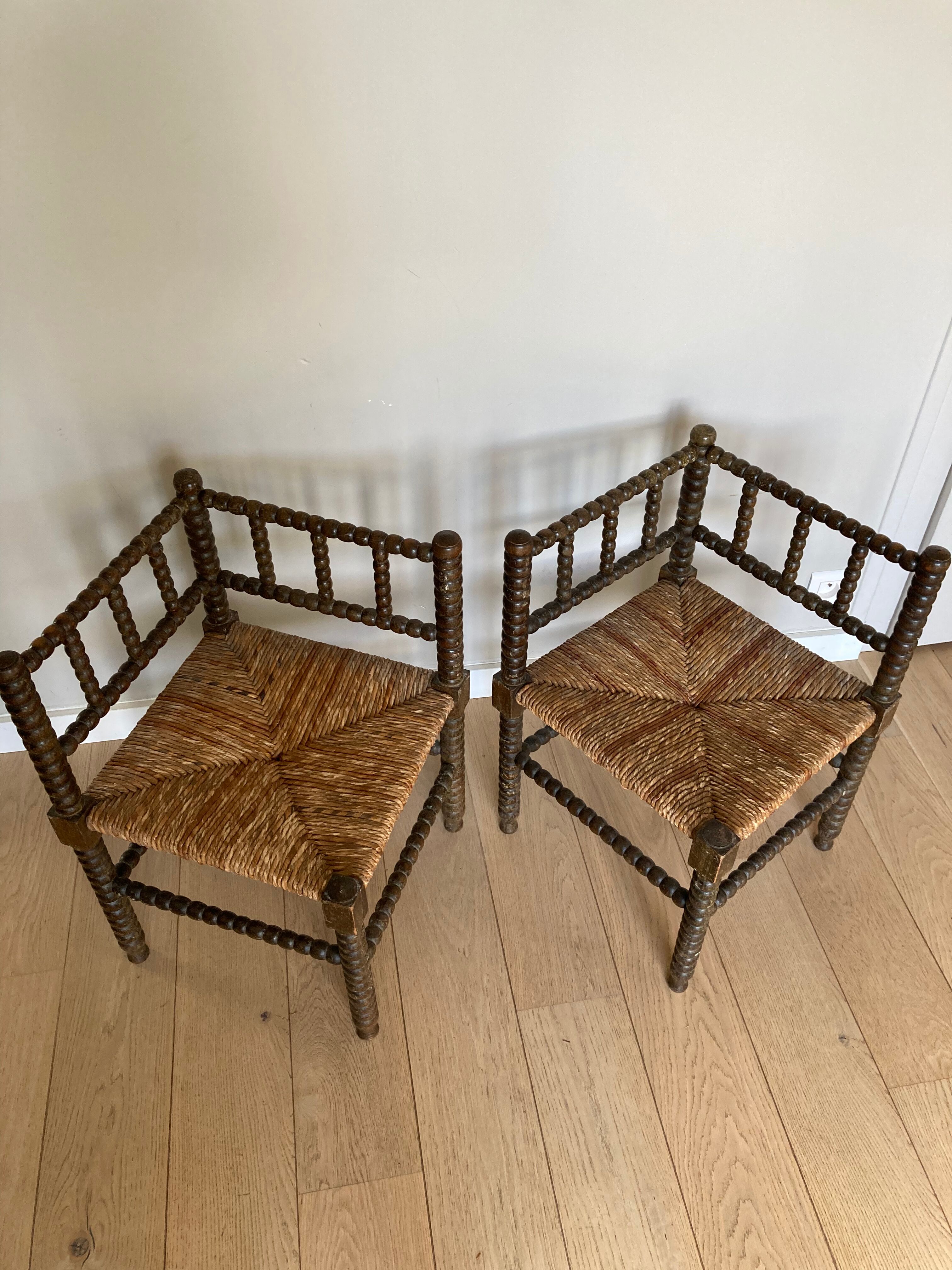 Turned wood corner armchairs