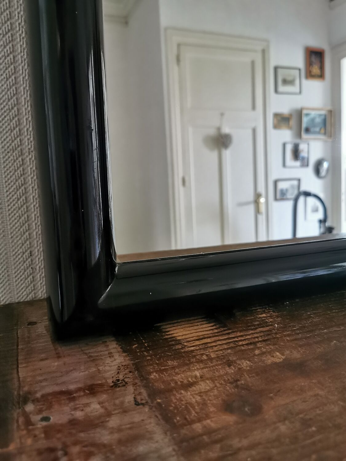 Large black lacquered mirror 1970