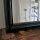 Large black lacquered mirror 1970
