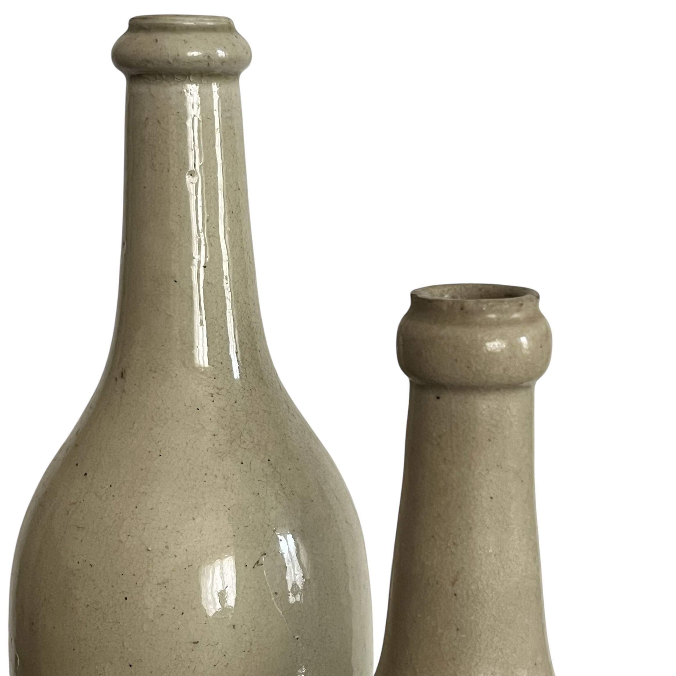 Pair of old glazed stoneware bottles