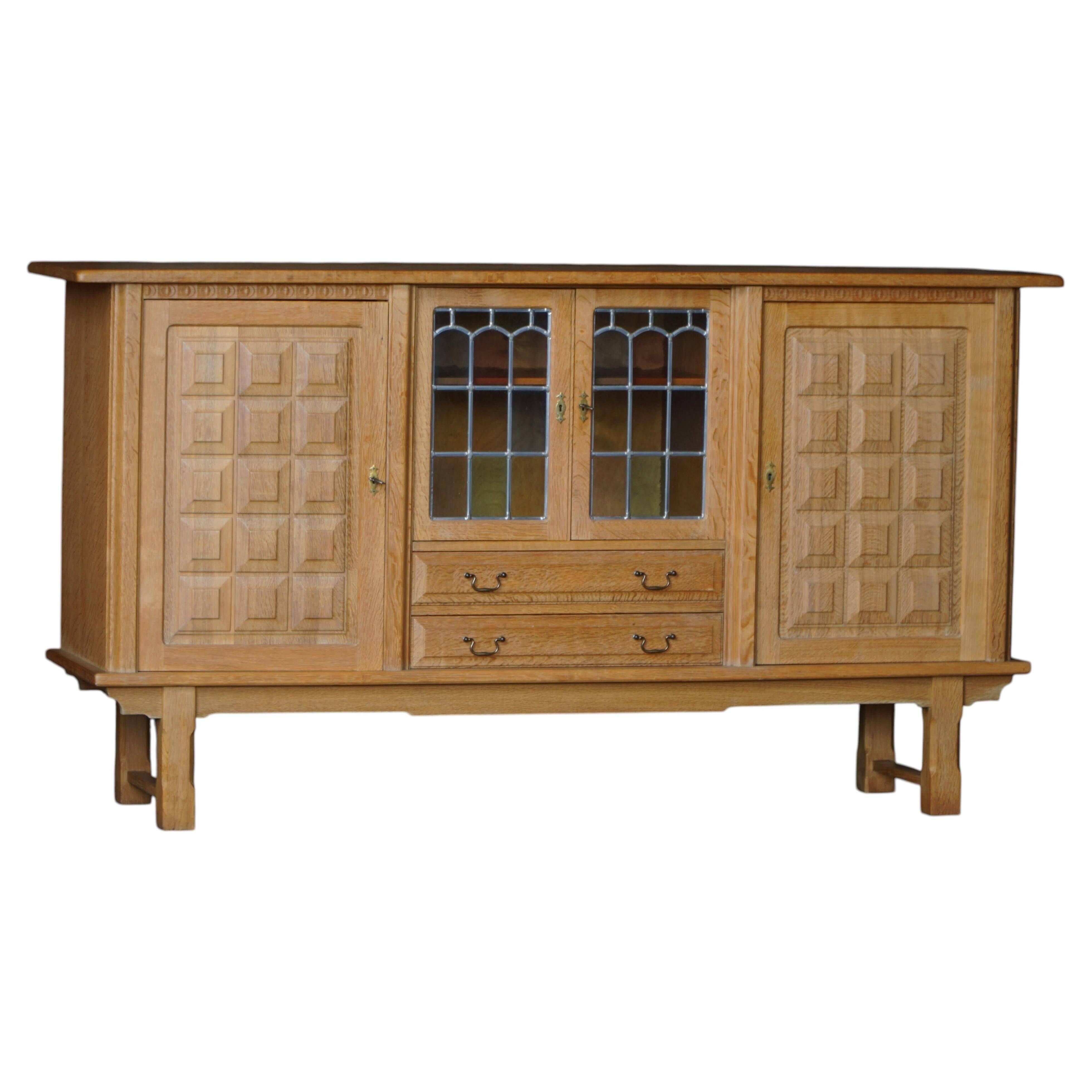 Danish oak buffet with lead glass doors, Henning Kjærnulf, Denmark, 1960s