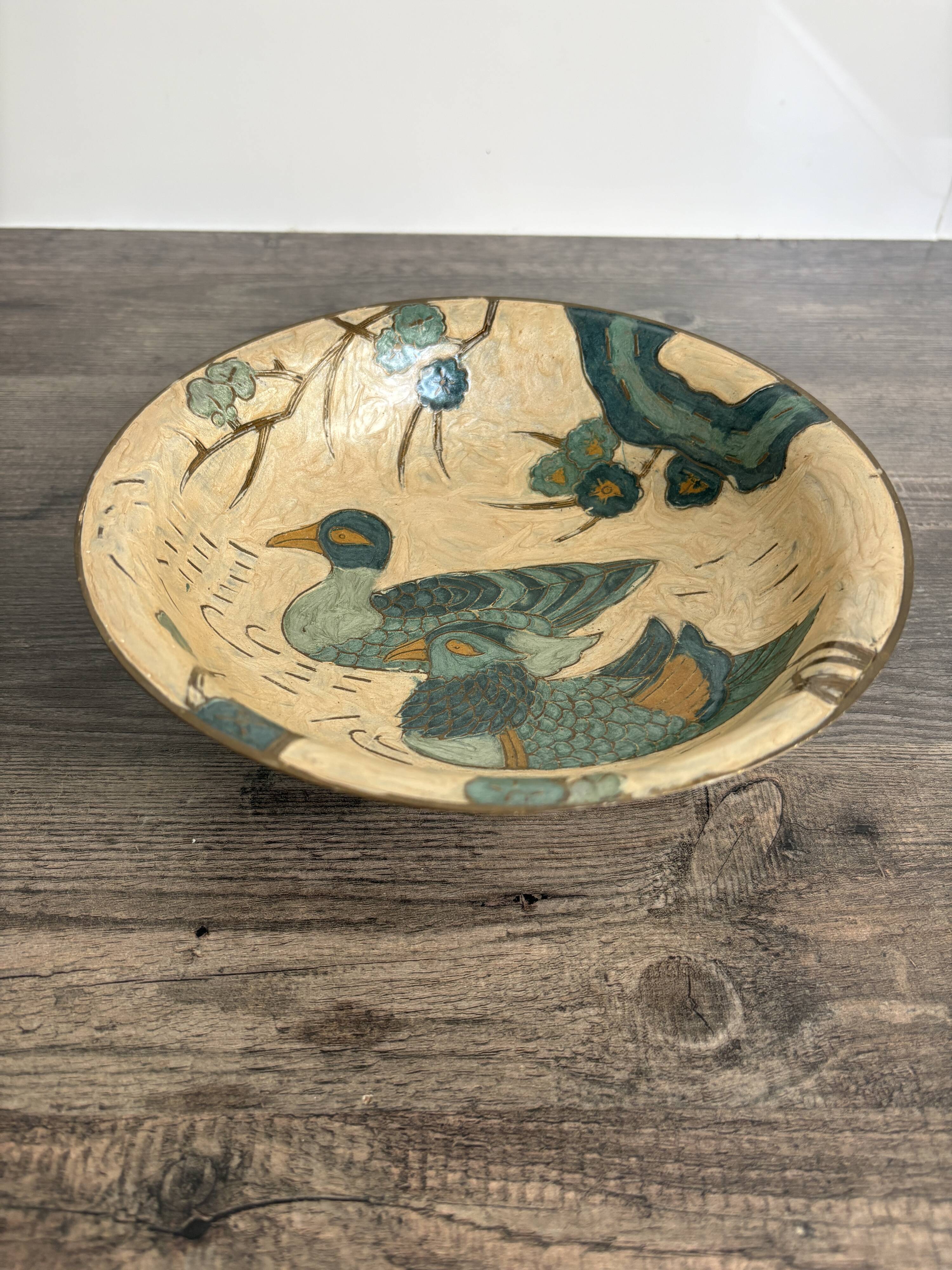 Antique enamelled brass cup