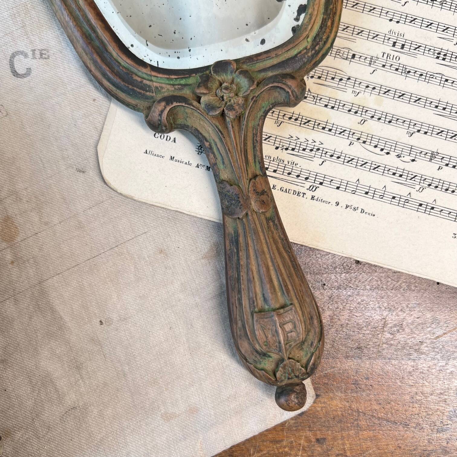 Wooden “hand-held” mirror with MB initials