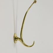 Two curved wall coat racks in brass by Franz Hagenauer, Vienna, mid-20th century, 1950s.