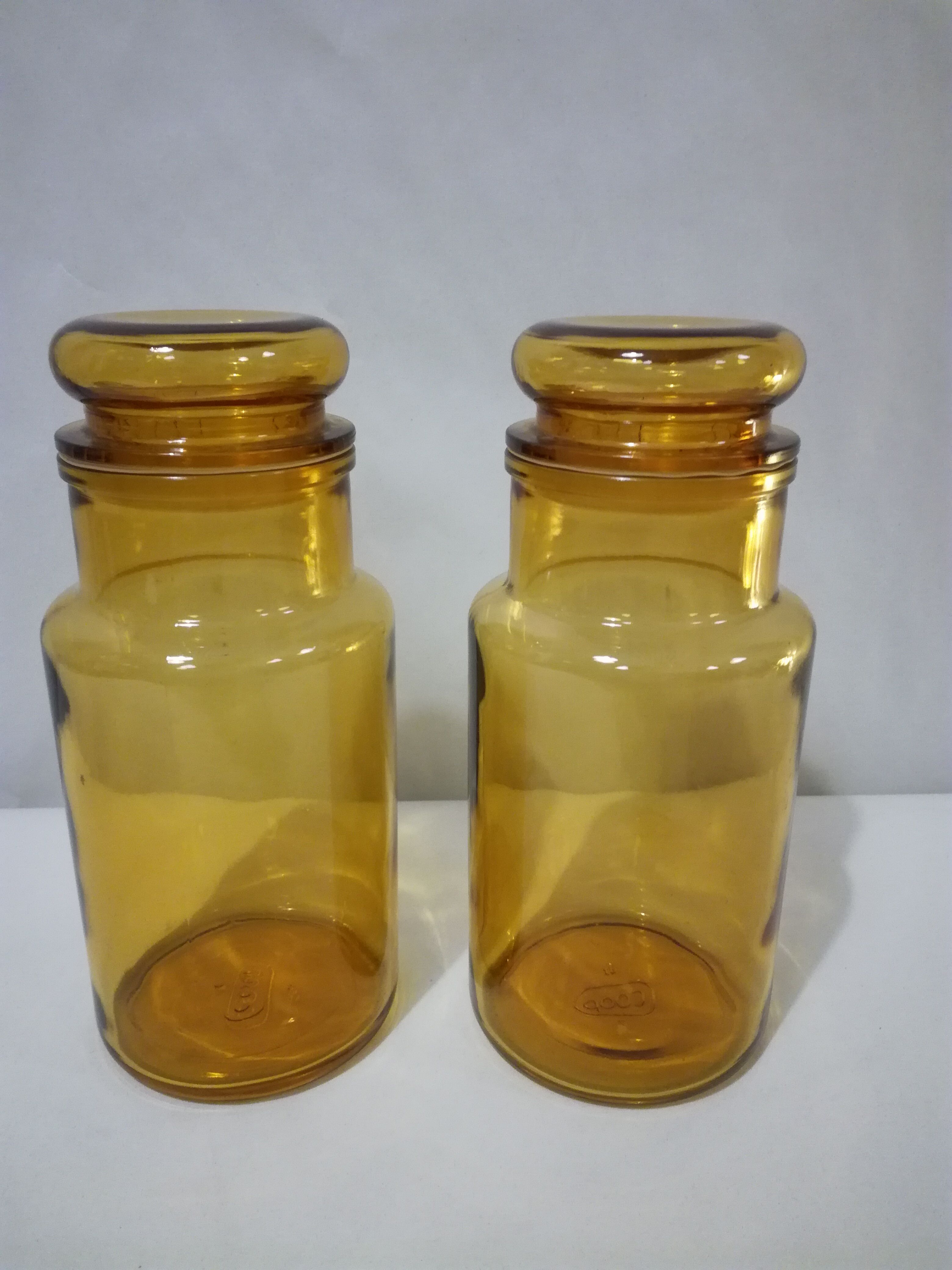 Two amber jars