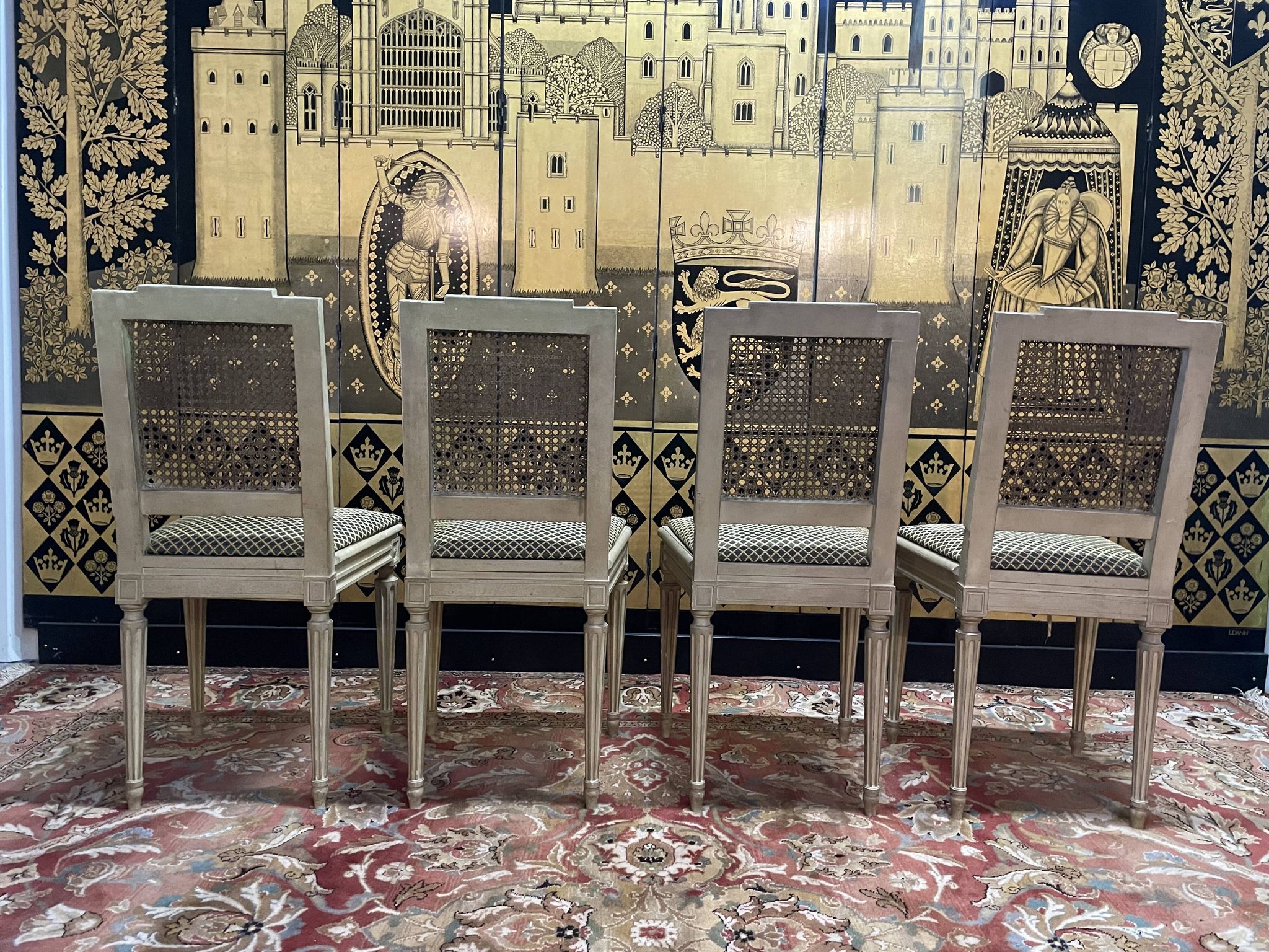 Suite de 4 chaises cannées style Louis XVI Jean Mocque