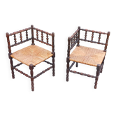 Pair of angled armchairs with turned wood and rush seats from the 1960s.