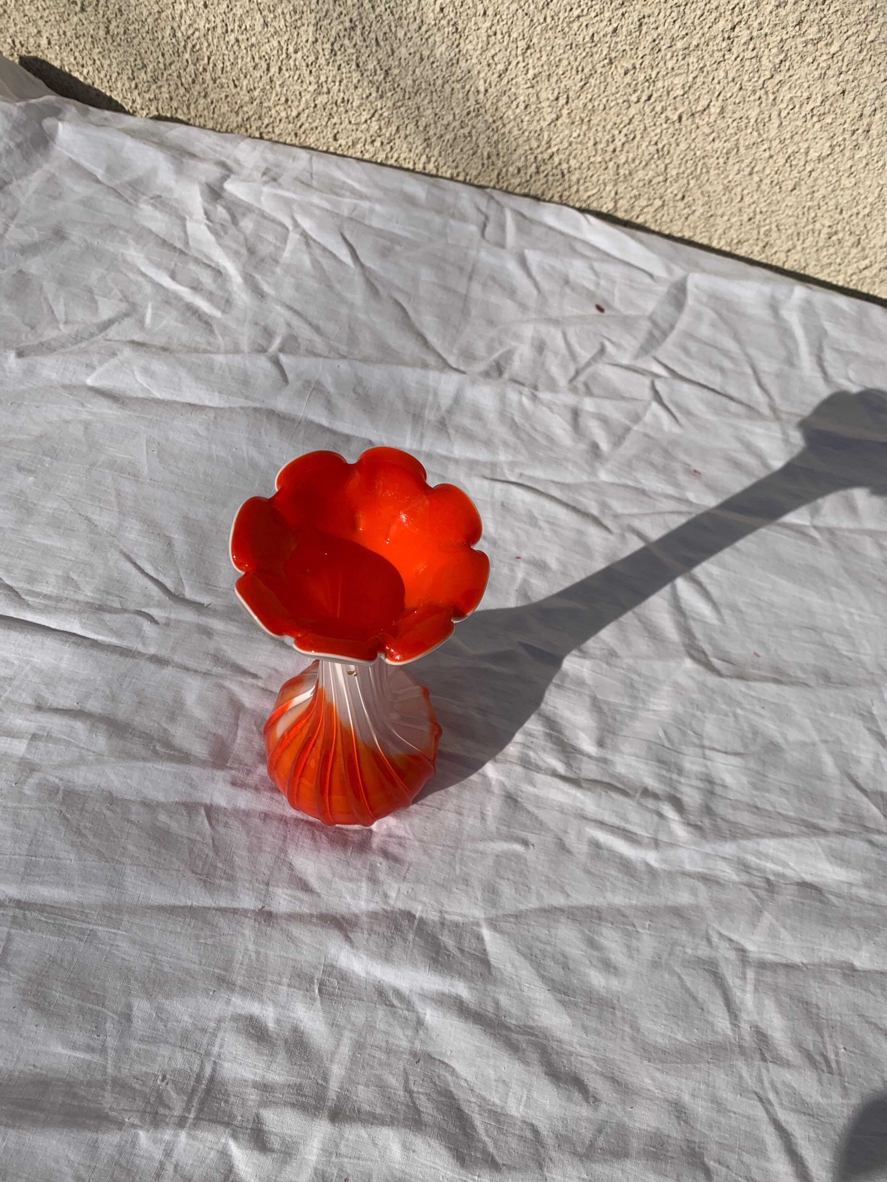 Orange and white opaline vase in the shape of a vintage flower corolla