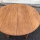Round extendable banquet table stripped in solid mahogany with 4 extensions, 19th century.
