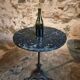 Old French bistro table with a marble top and a cast iron base.