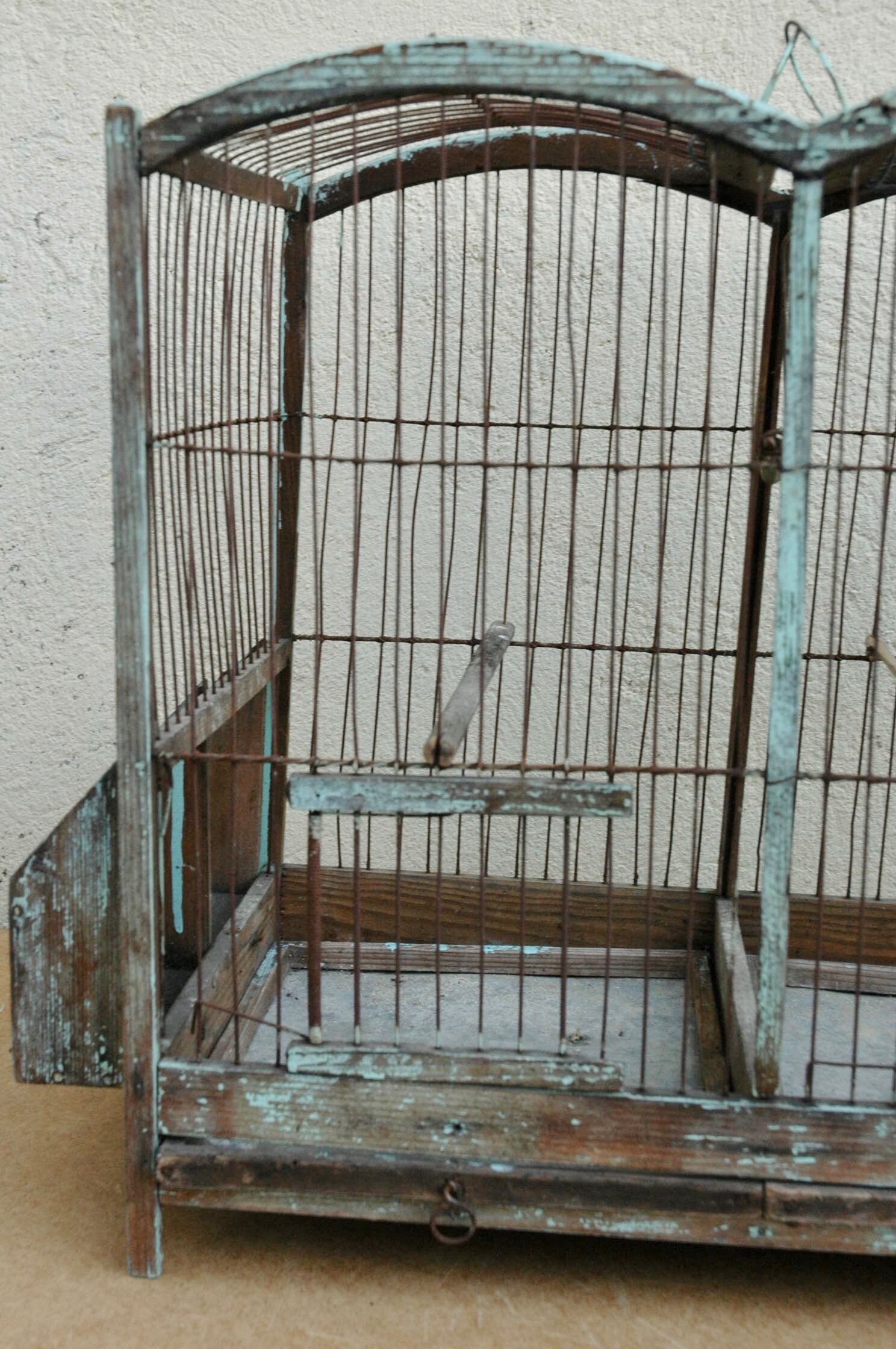 Ancient bird cage in wood and metal