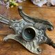 Hand candlestick, peacock shape, in bronze