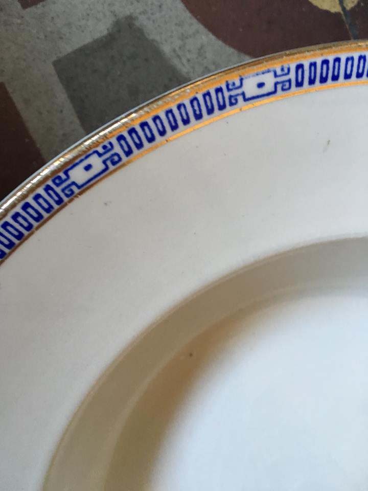 Six soup plates don't match in red and blue.