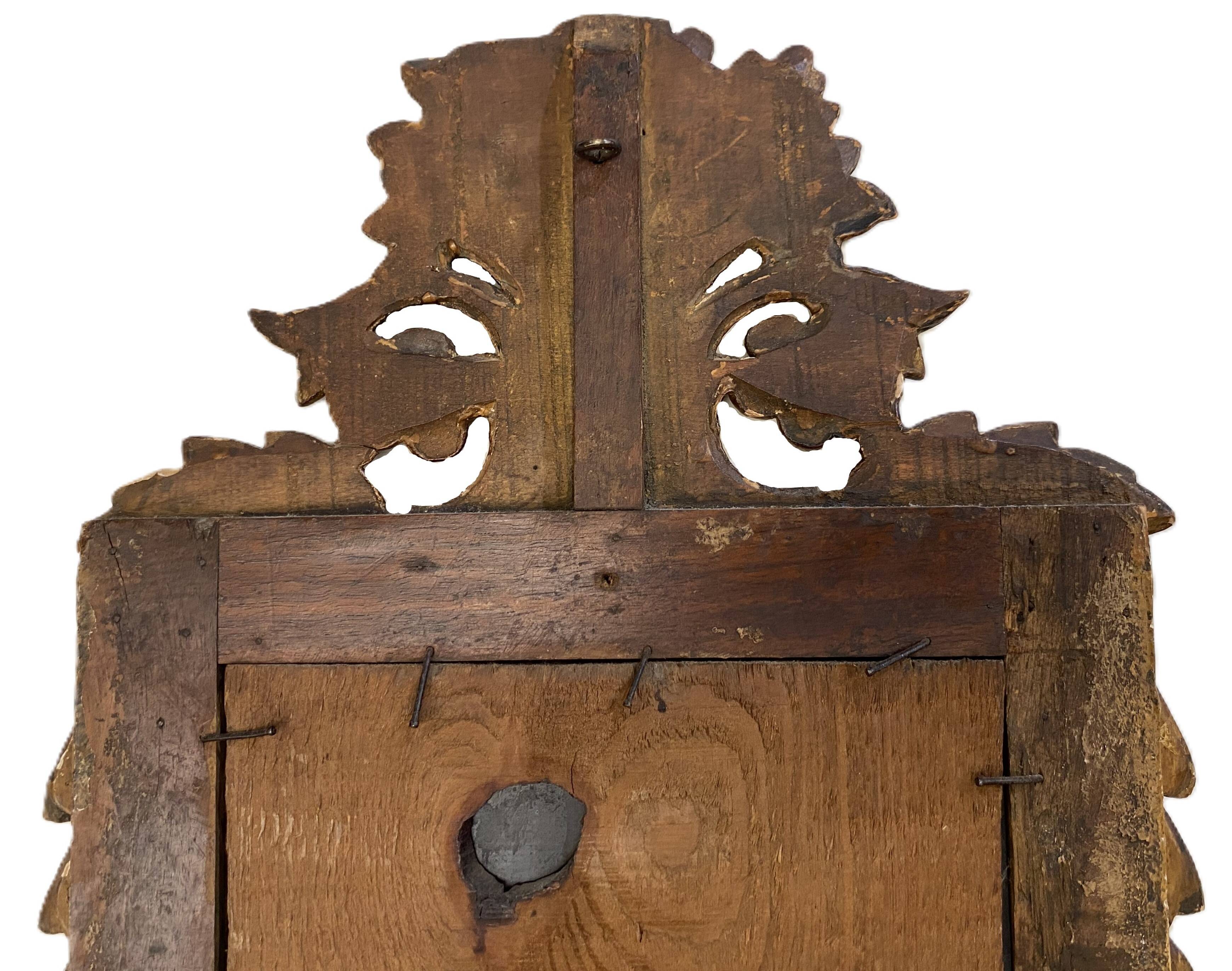 Petit miroir de dame Louis XVI en bois sculpté et doré