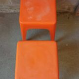 Pair of AMI stools in orange plastic