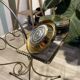 Gold wrought iron ashtray on legs with magazine rack and marbled shelf