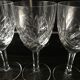 Crystal cut water stemmed glasses. Star and leaf patterns.