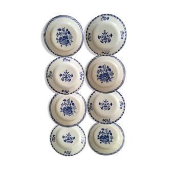 Eight flat plates with old flowers in blue