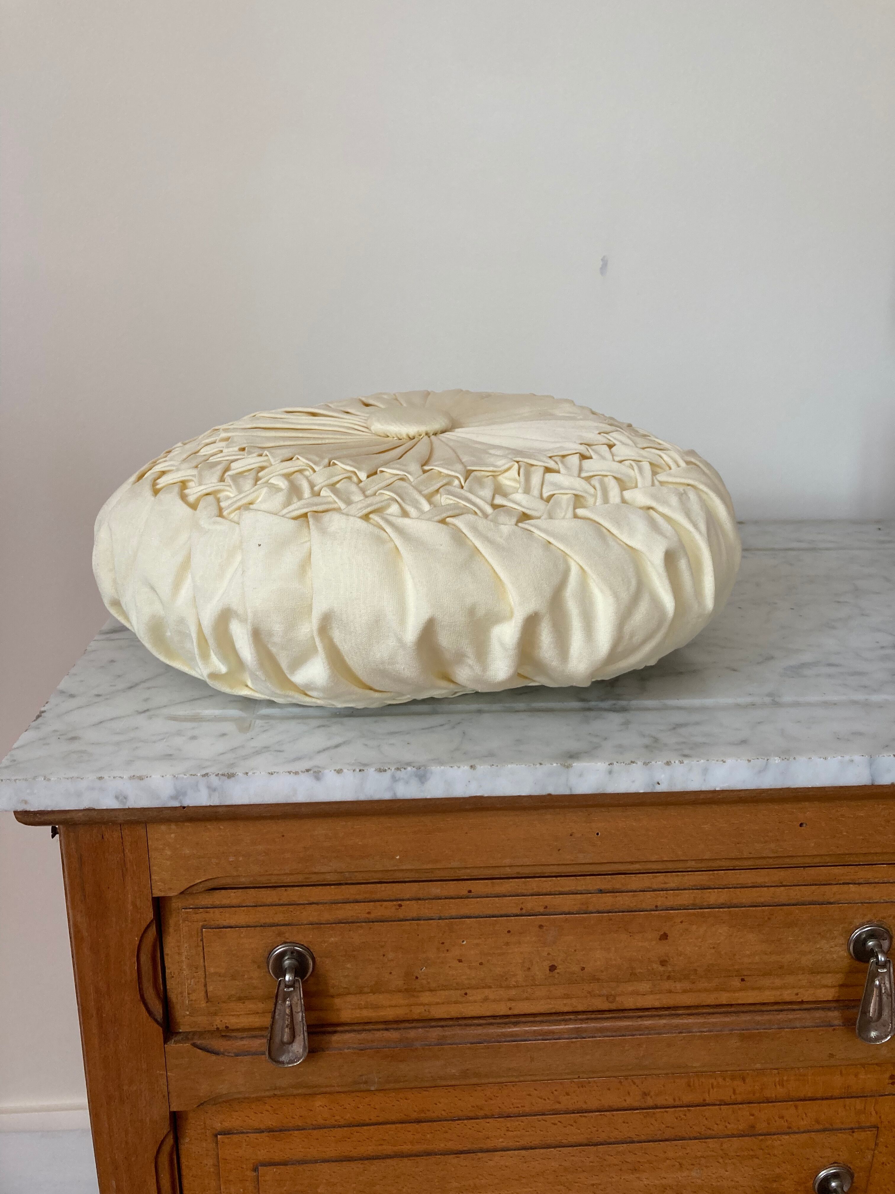 Cushion in beige fabric