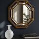 Octagonal wall mirror in cobalt blue eglomisé glass and gilded wood, Spain.