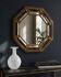 Octagonal wall mirror in cobalt blue eglomisé glass and gilded wood, Spain.