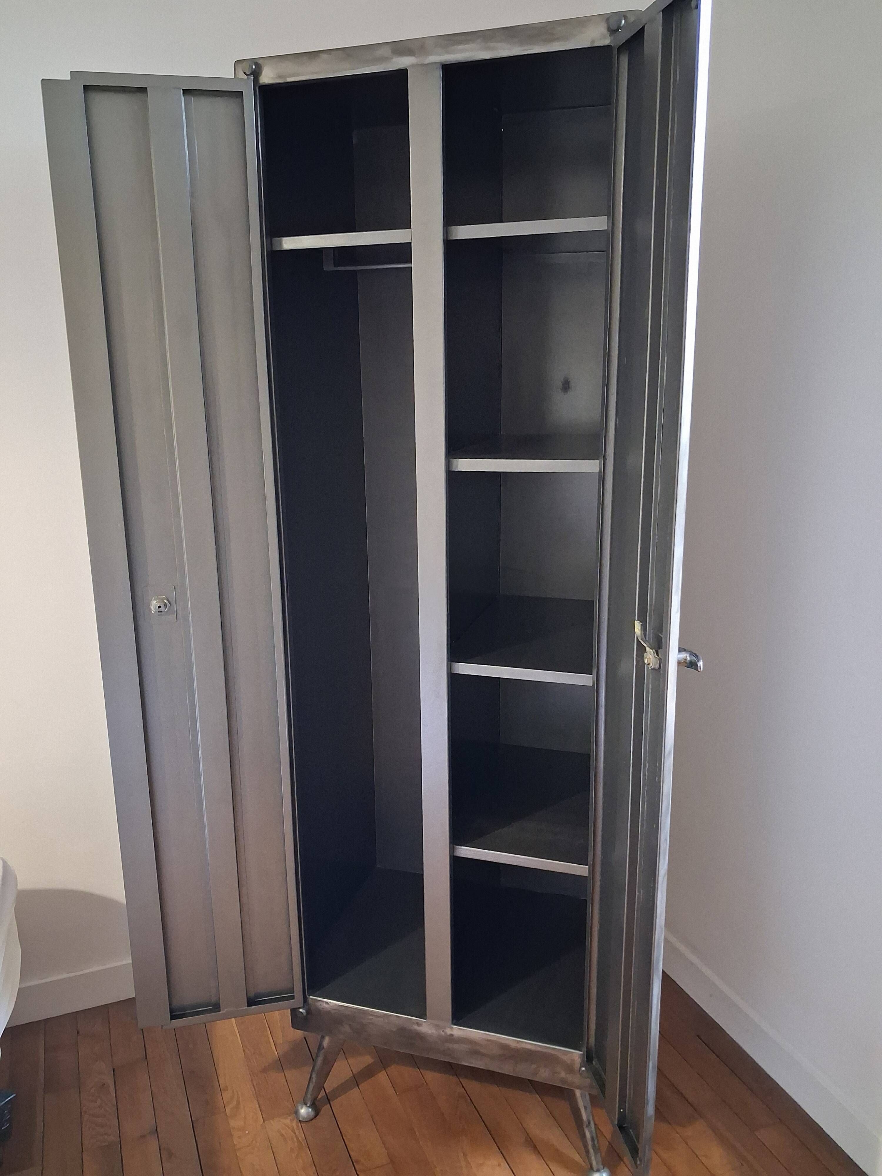 1960s factory infirmary metal cabinet with ball feet and compass.