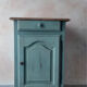 Small vintage side table in sage green patina and solid wood.