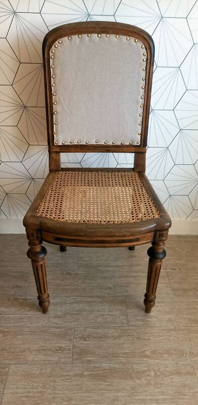 Solid oak art deco chair with cane and fabric.