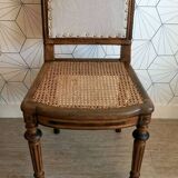 Solid oak art deco chair with cane and fabric.