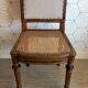 Solid oak art deco chair with cane and fabric.