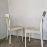 Set of 6 mismatched white chairs