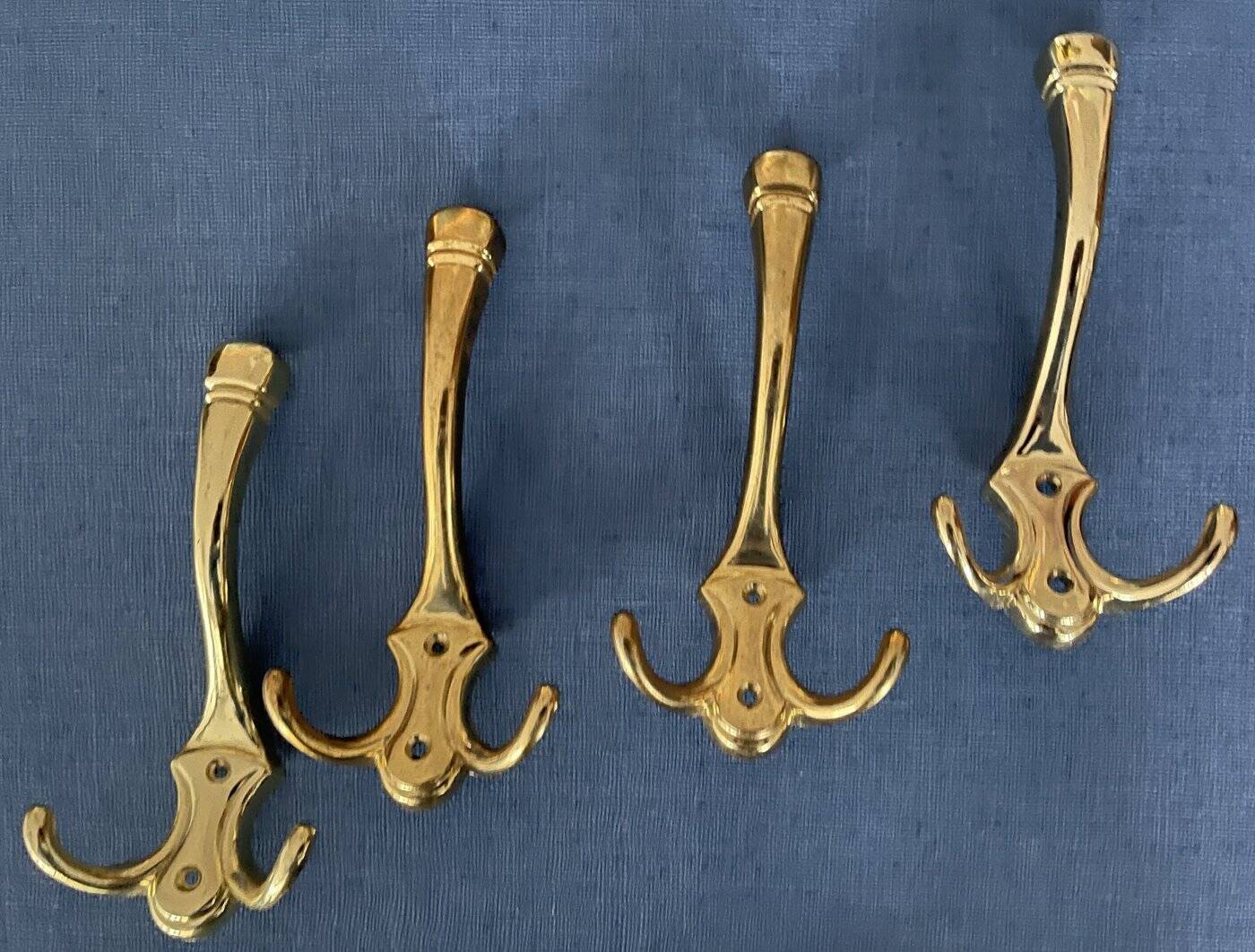 4 golden brass coat racks