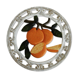 Dessous de plat vintage en fonte décor blanc et oranges