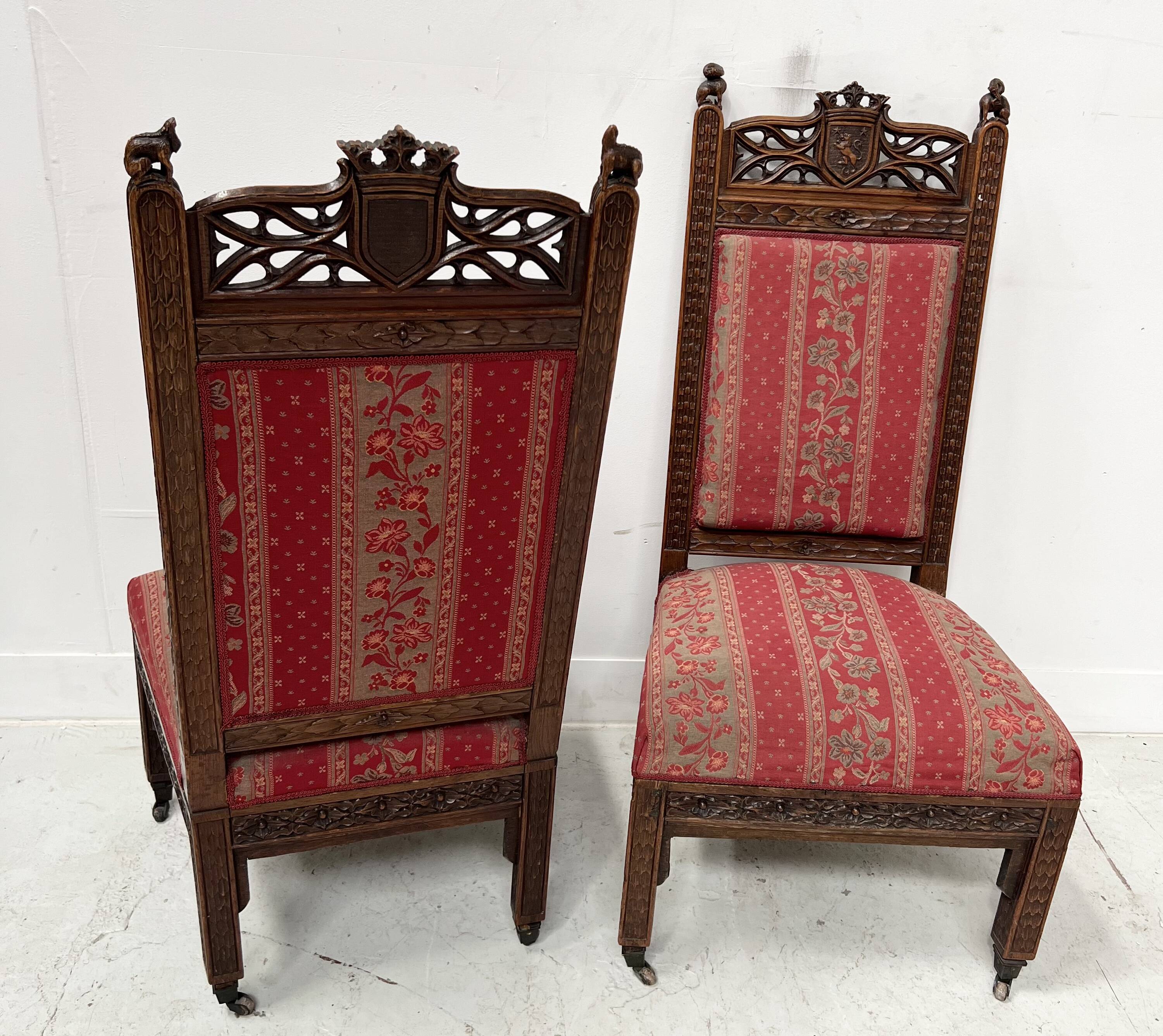 Pair of Gothic-style walnut lounge chairs, 19th century