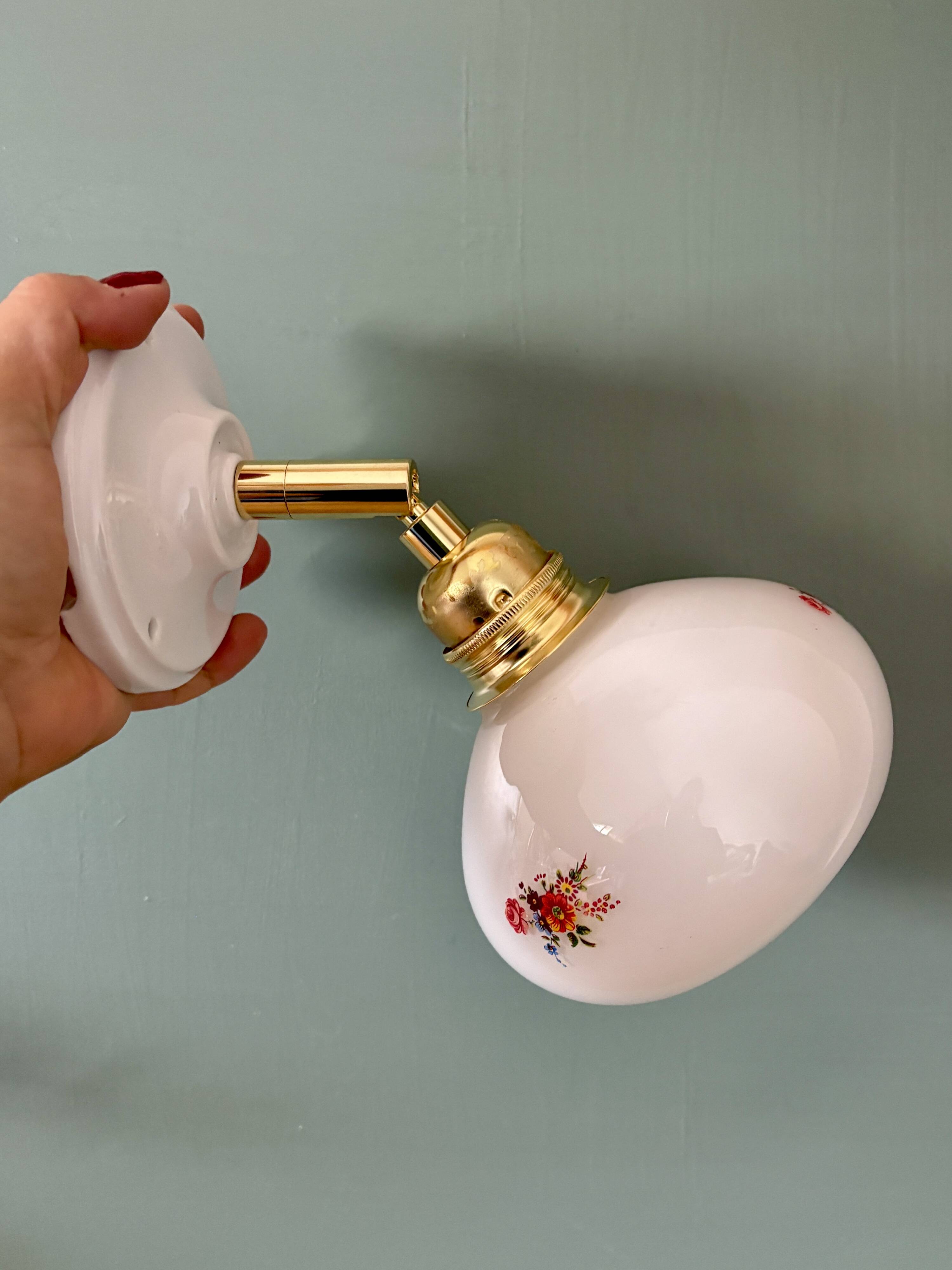 Vintage globe wall sconce in white opaline glass with floral decorations