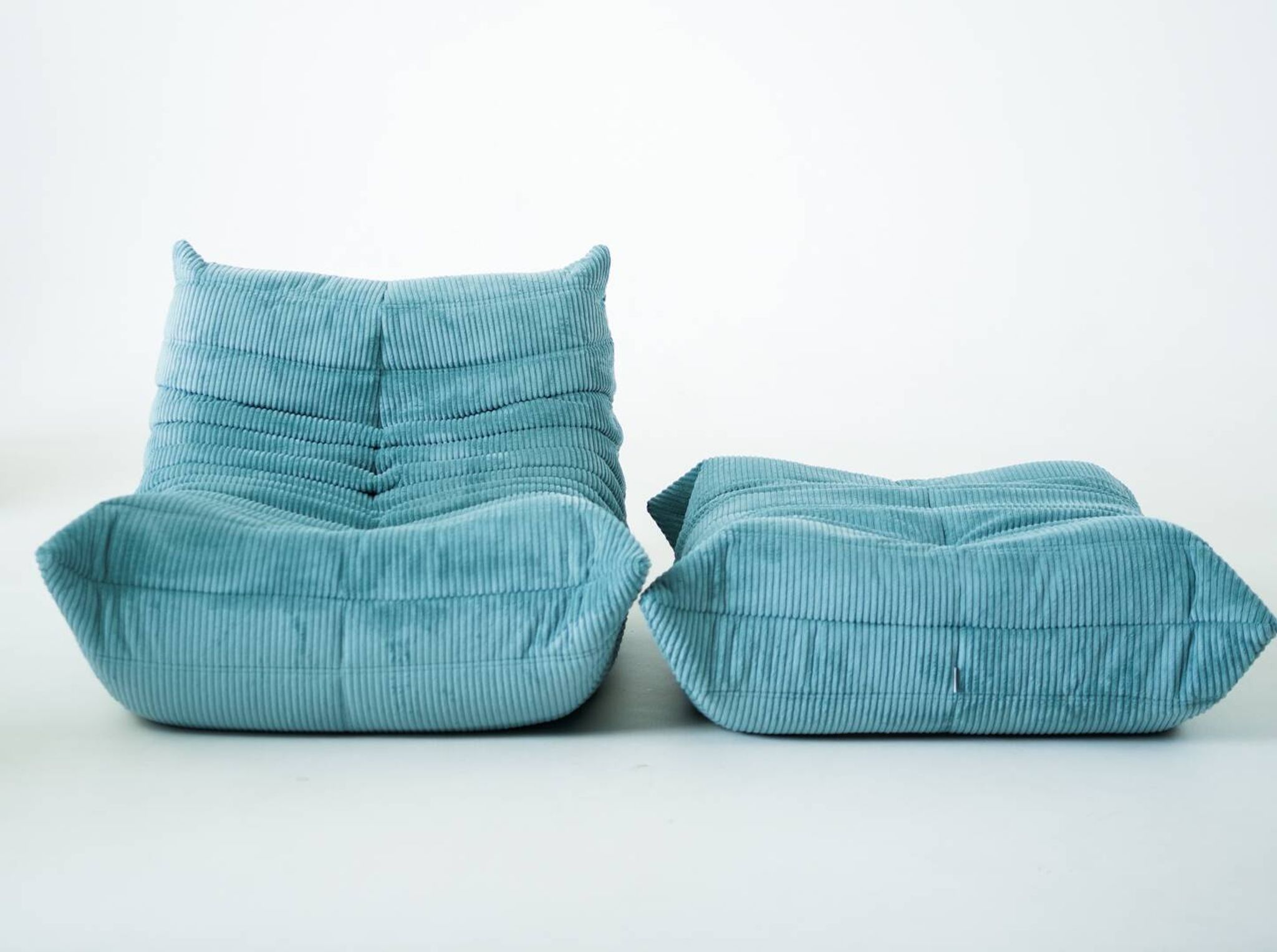 Togo set of armchair and pouf in light blue corduroy