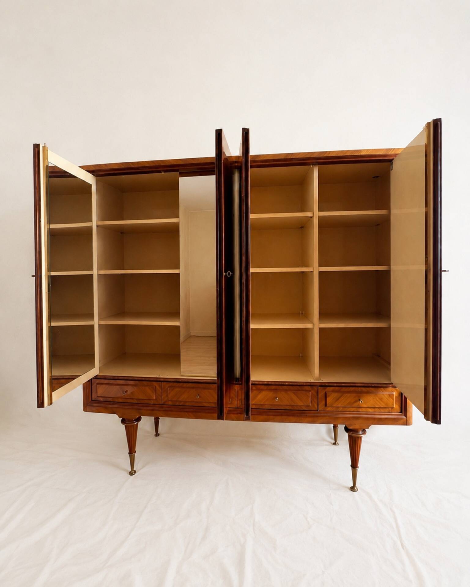 Vintage 4-door chevron wood wardrobe with mirror and gold legs.