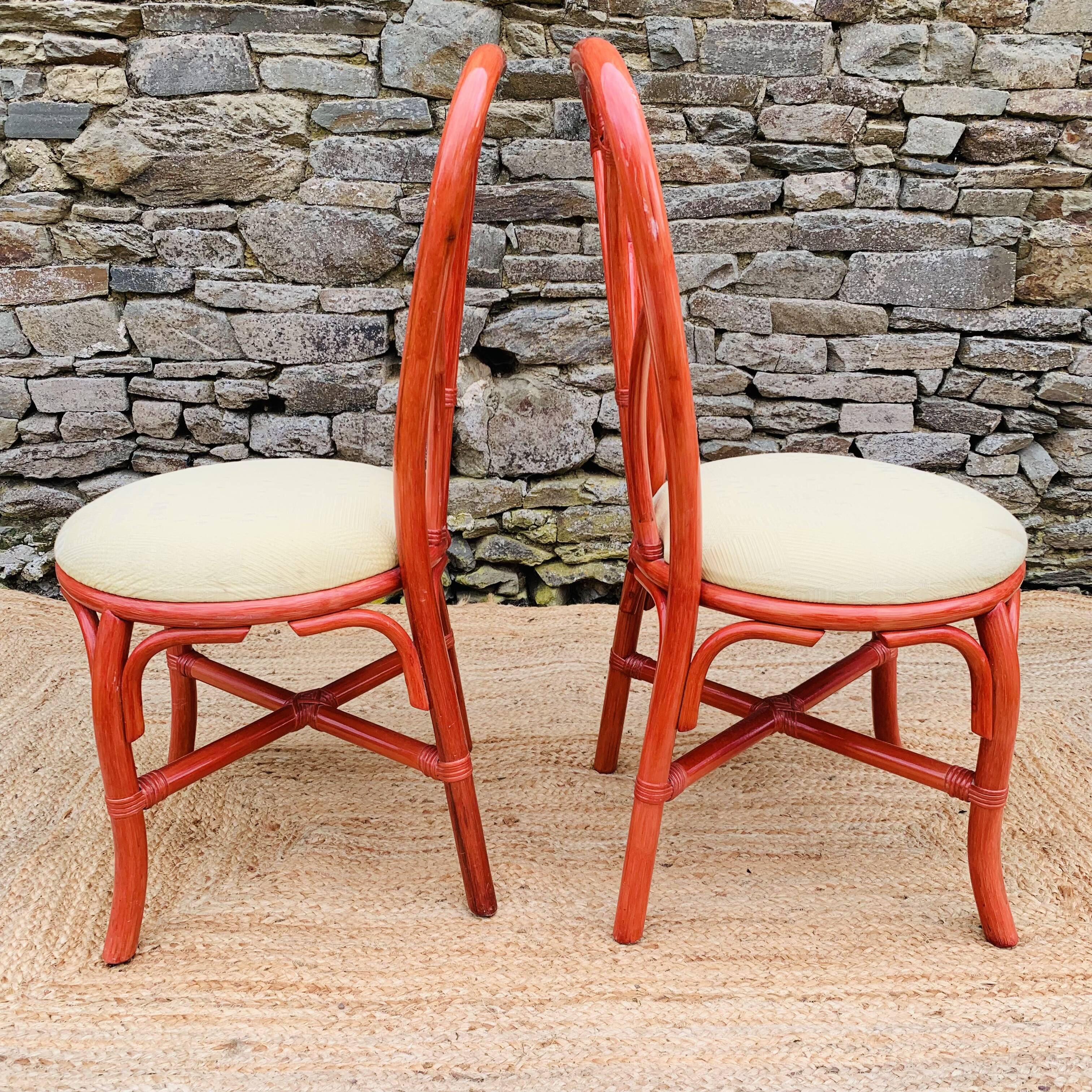Pair of red rattan chairs and fabric