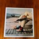 ⸻  Vintage Color Photograph from 1973 – Shoes on Wooden Deck