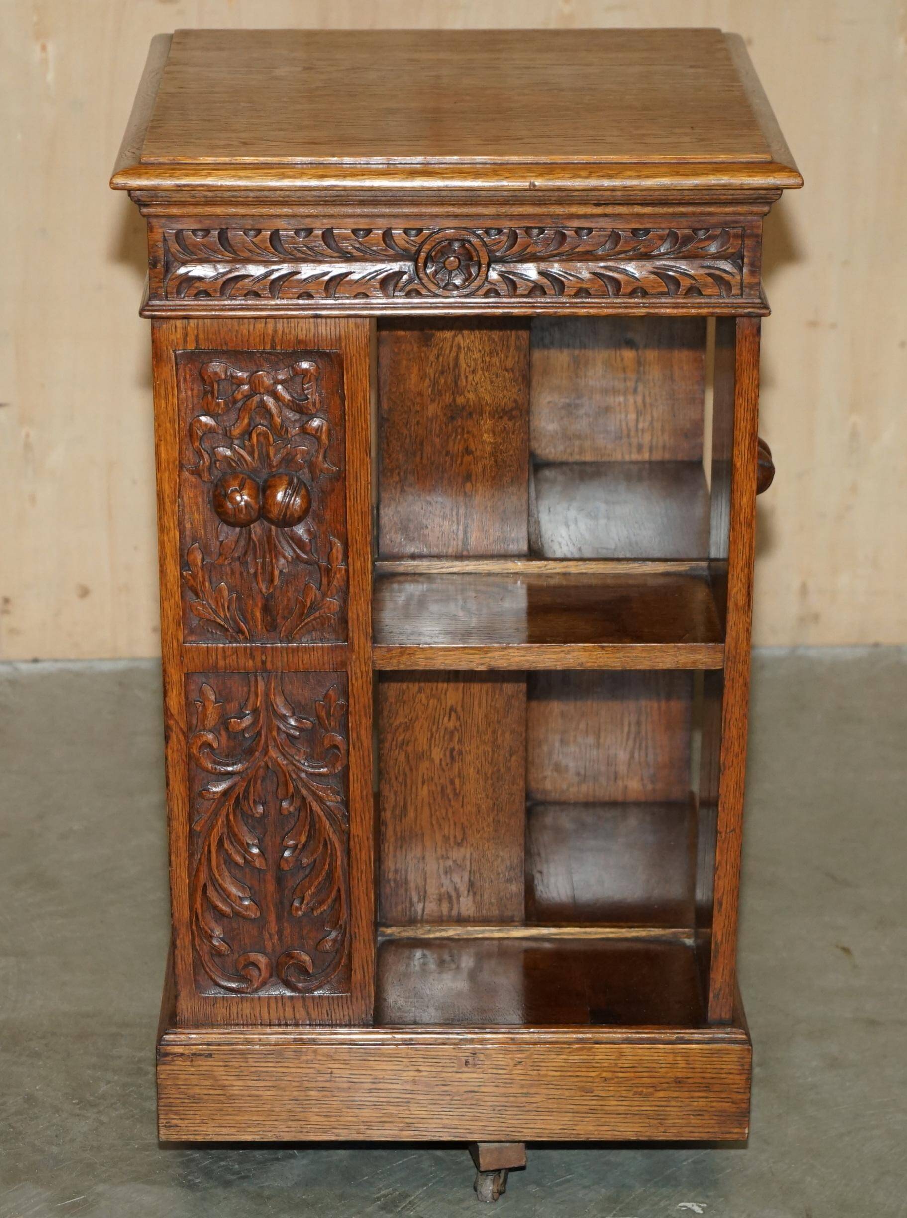 Victorian carved oak revolving library, circa 1880.