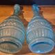 Pair of cut blown glass carafes in blue-green from the 19th century.