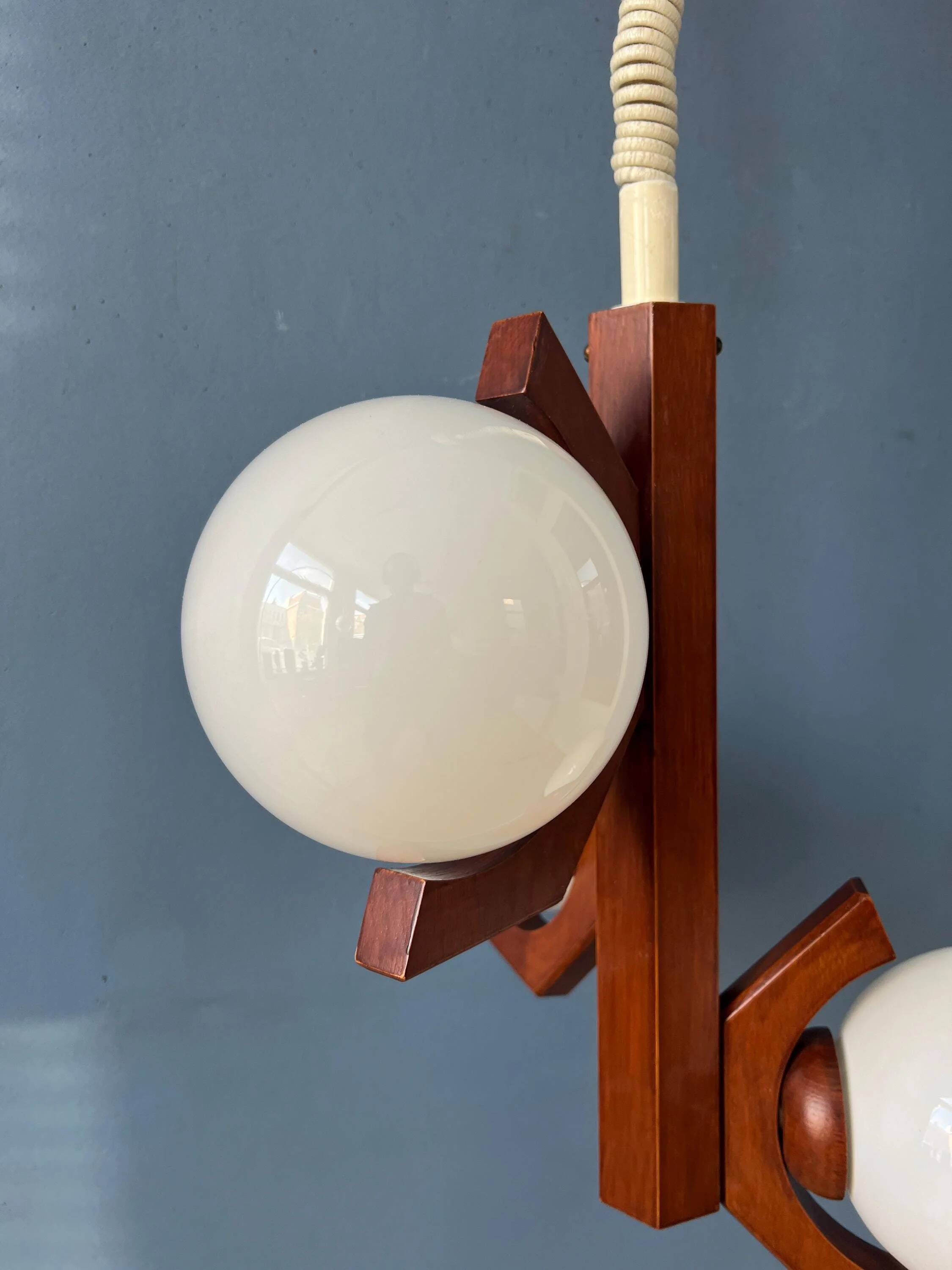 Mid-century brown Bony suspension with opaline glass shade.