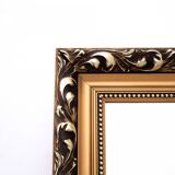 Unique mirror in gold frame.